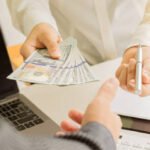 Describe how total job benefits and total employee compensation differ.